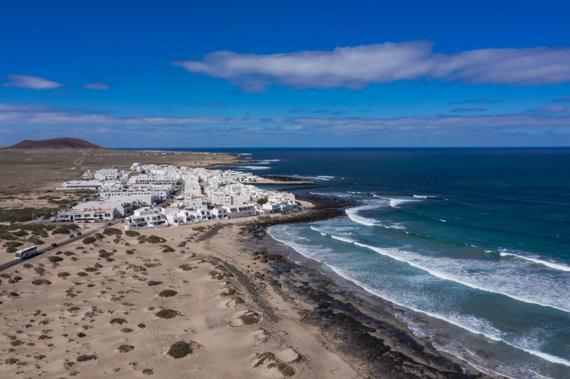 A 6-kilometer stretch of golden sand that serves as the primary training ground for students. This wide expanse is the heart of every famara surf school tour.