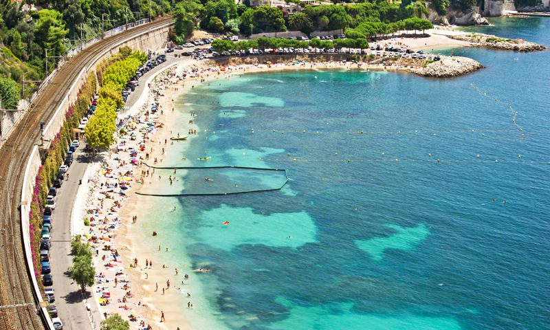 During peak summer, this protective barrier ensures a safer environment for snorkelers to explore the clear bay waters.
