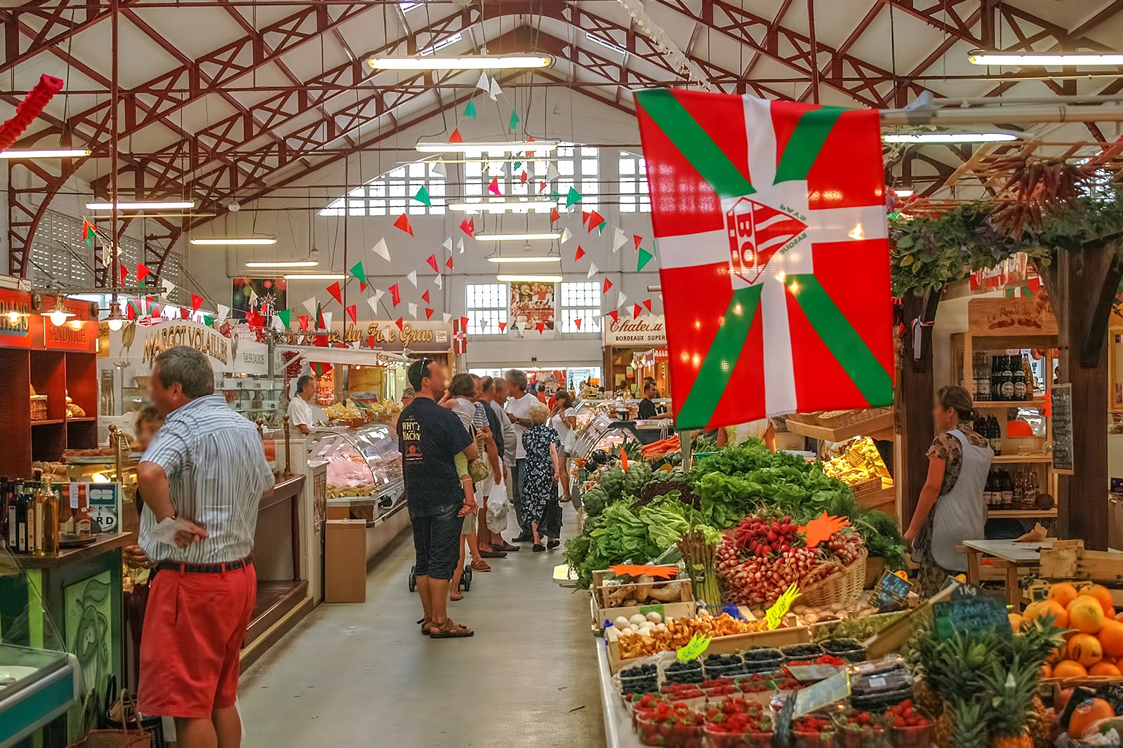 The vibrant heart of the market featuring artisanal cheeses like Ossau-Iraty and local charcuterie. This area showcases the best of Basque gastronomy.