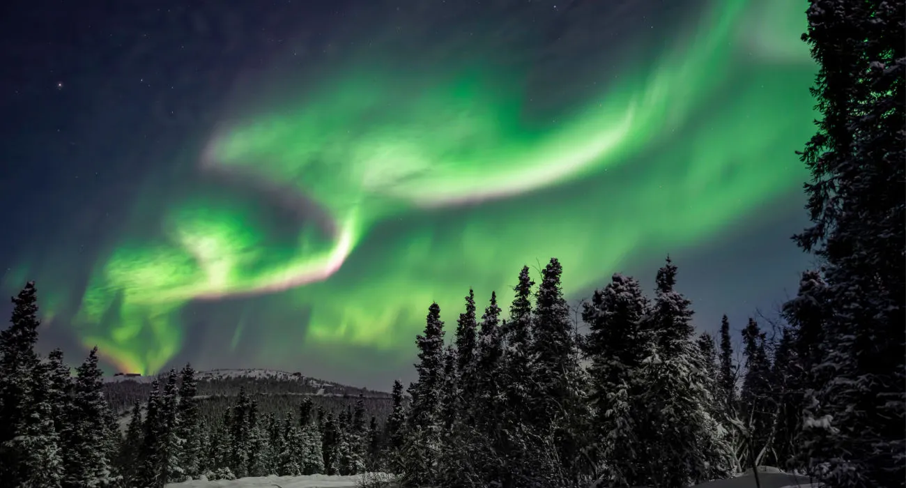 Arctic mountain aurora display