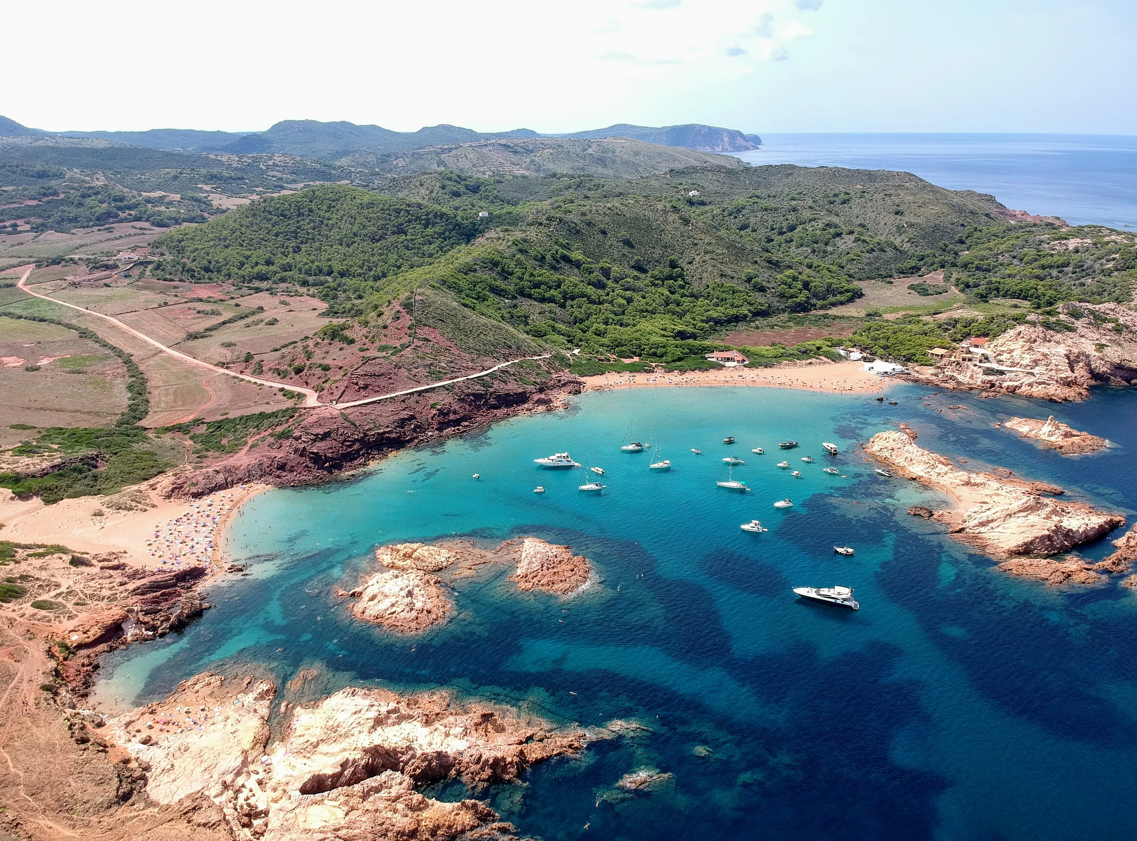 Cala Pregonda Red Rocks