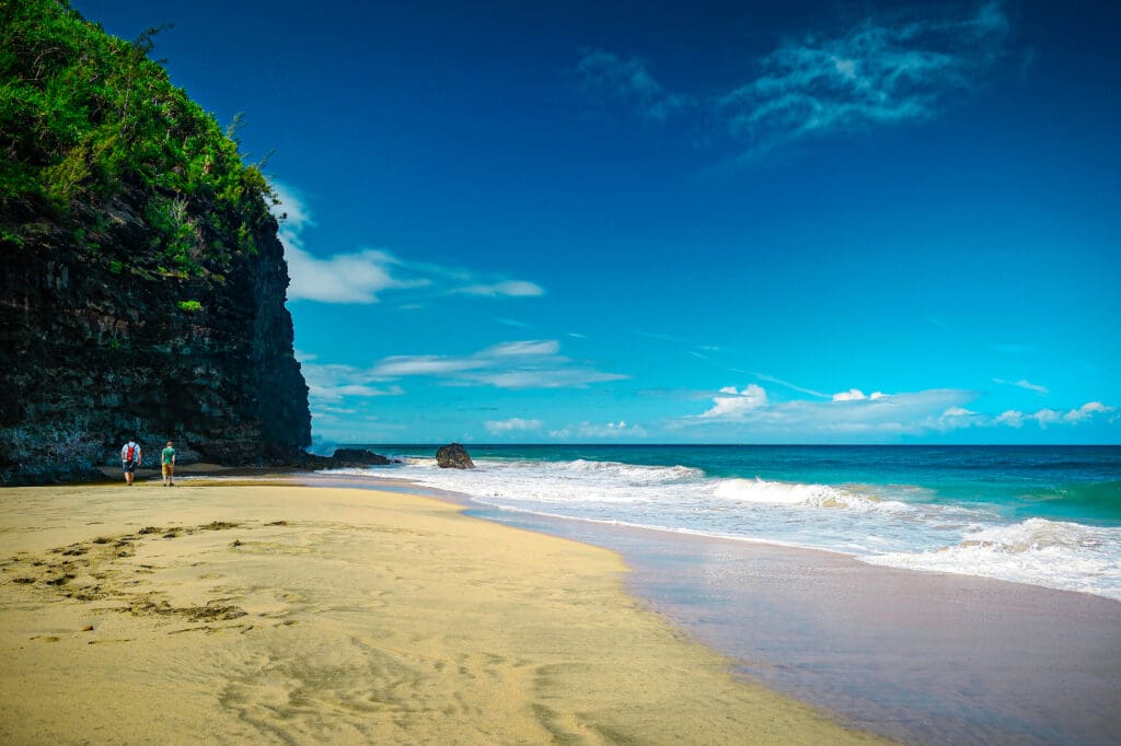 Tour boats navigate through these deep-cut basalt structures carved by millions of years of wave action.